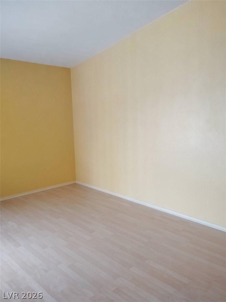 Image 3: A well-maintained room features durable laminate f