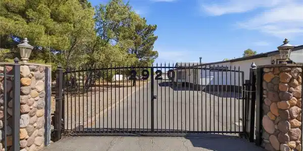 Image 4: A well-maintained home with a paved driveway and m