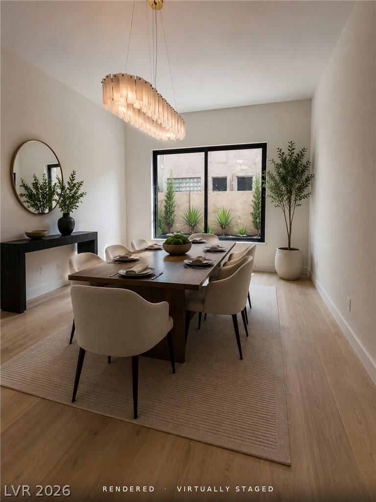 Image 4: Elegant dining space, illuminated by a linear chan