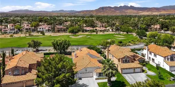 Image 2: A striking golf course backdrop frames tile-roofed