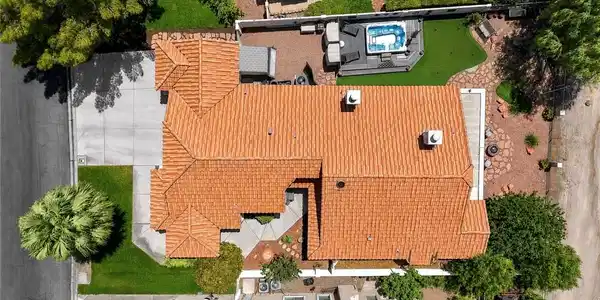 Image 4: A terracotta Spanish tile roof crowns this residen