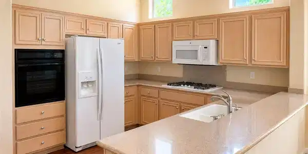 Image 3: Kitchen with abundant cabinetry and generous count