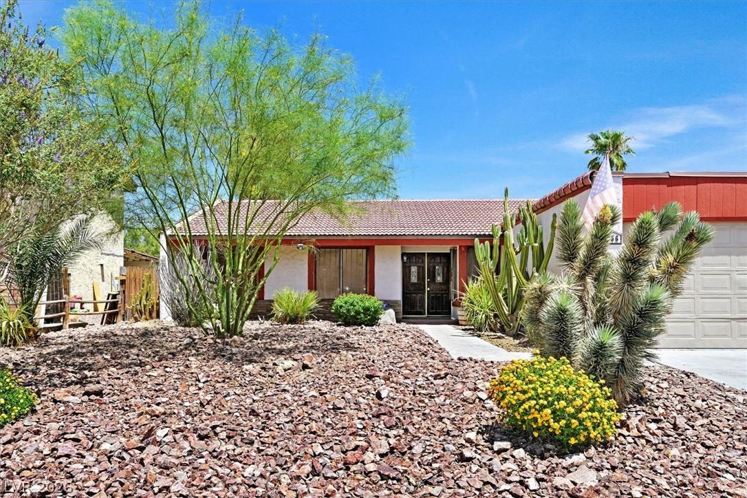 Image 1: A desert oasis awaits with drought-tolerant landsc