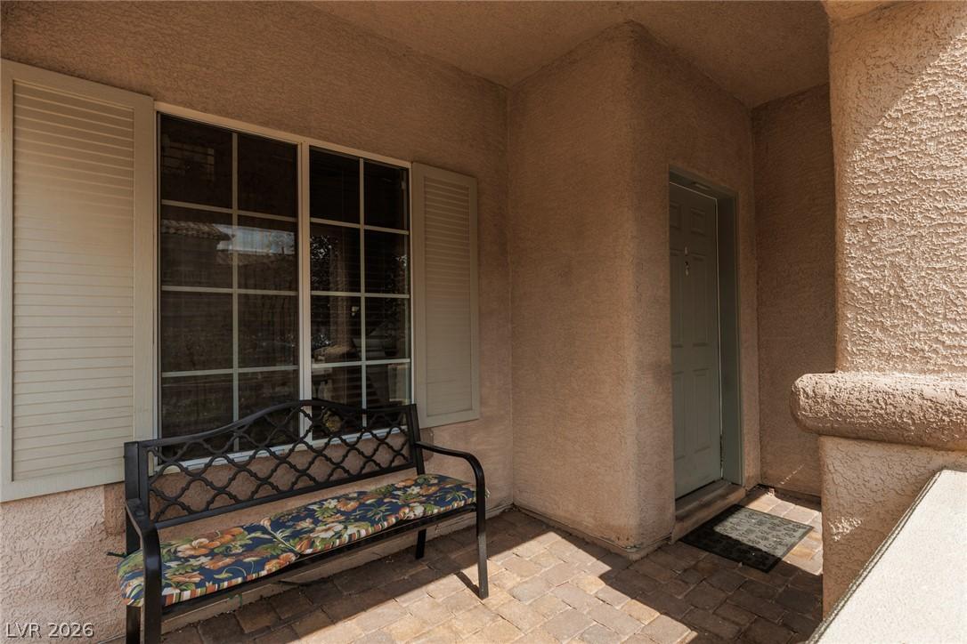 Image 4: A welcoming entry featuring paver flooring and tex