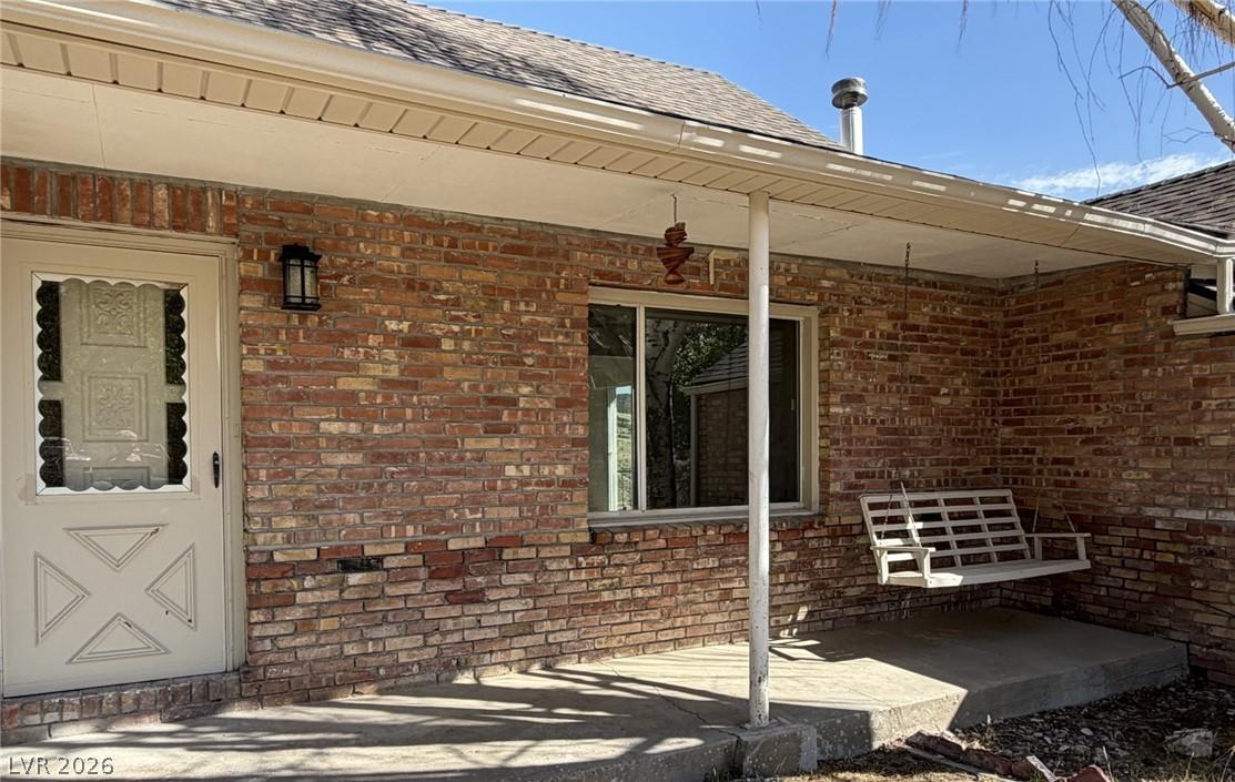 Image 4: A charming brick exterior with a welcoming porch s