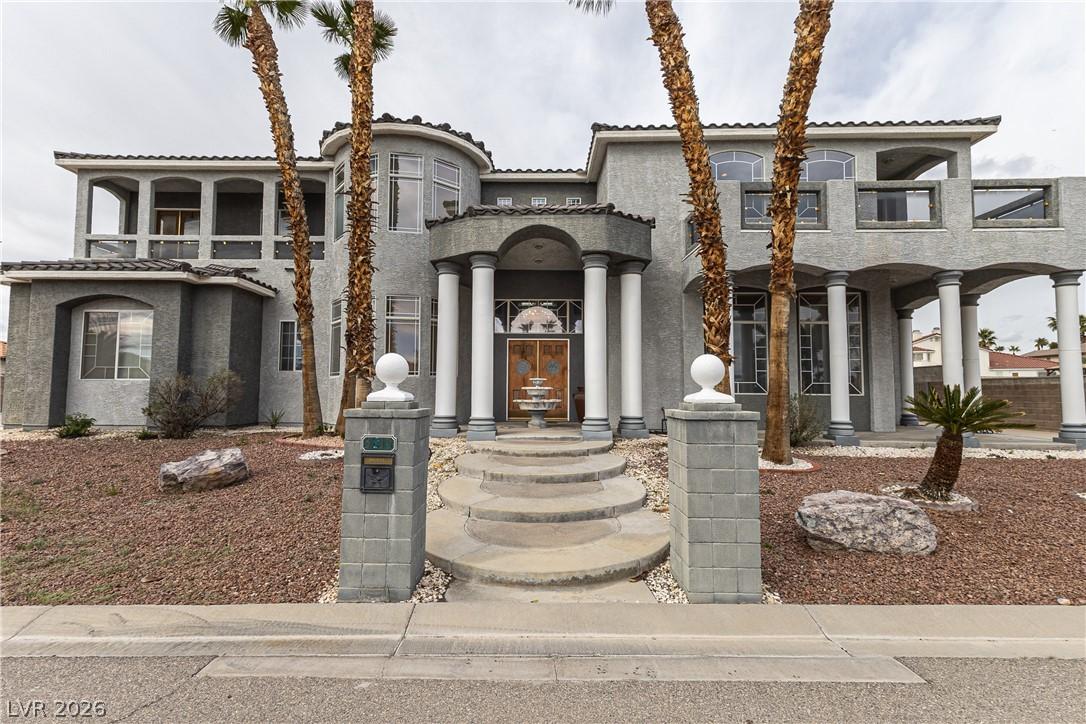 Image 3: Mediterranean / spanish home with stucco siding an