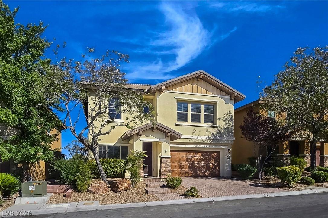 Image 3: A welcoming front exterior with a brick-paved driv