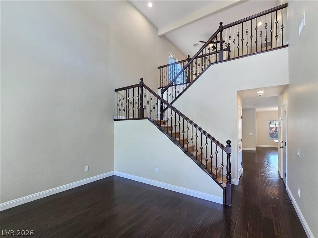 Image 4: A grand two-story entryway welcomes with gleaming