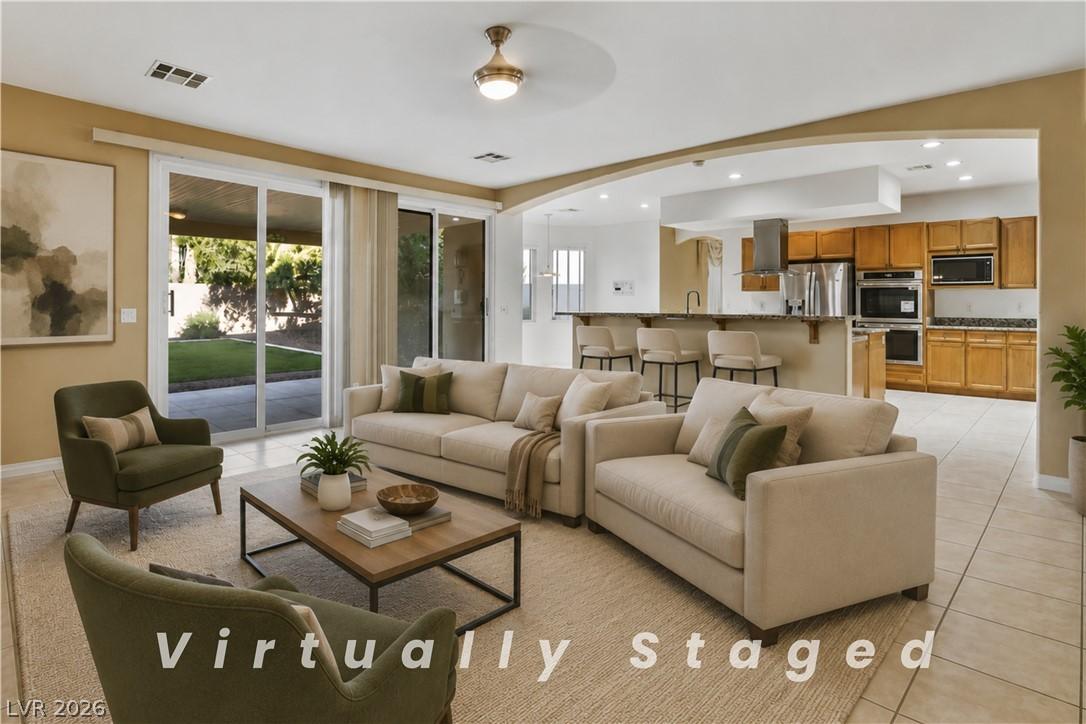 Image 1: An open floorplan seamlessly connects the living a