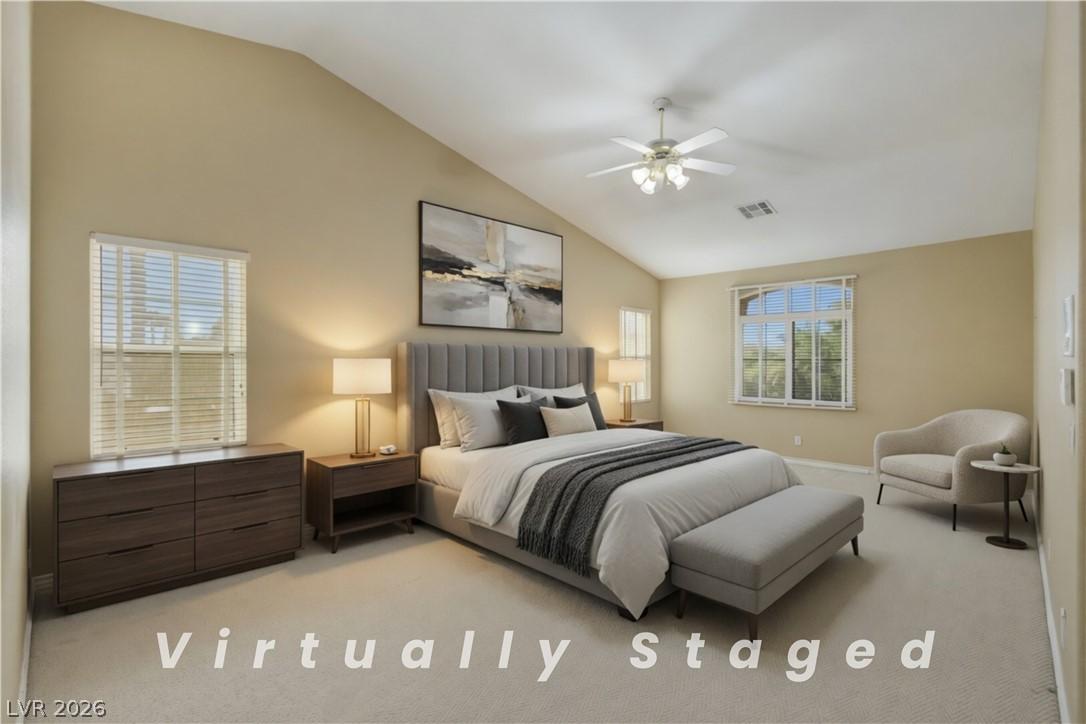 Image 2: An airy primary bedroom awaits, featuring soaring