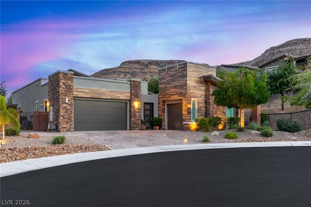 Image 1: Modern desert architecture with stone accents and