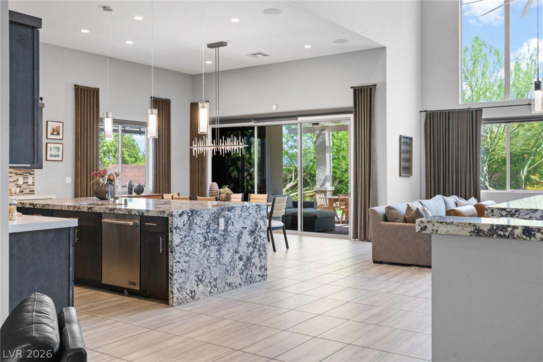 Image 2: An open-concept living space with sleek, light-col