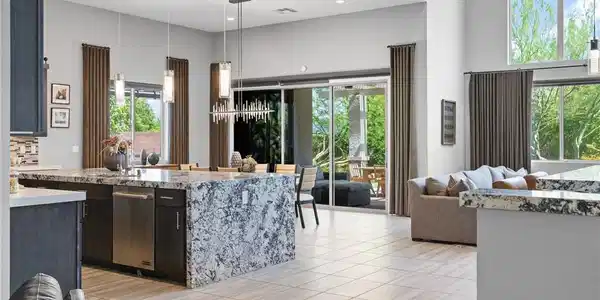 Image 2: An open-concept living space with sleek, light-col