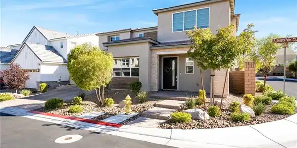 Image 3: A modern two-story exterior highlights clean archi