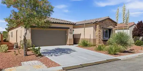Image 2: A well-maintained desert-style dwelling presents a