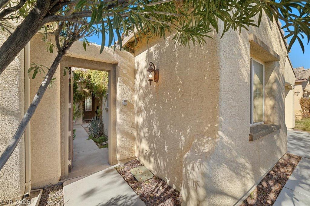 Image 2: An inviting gated entry offers a charming welcome