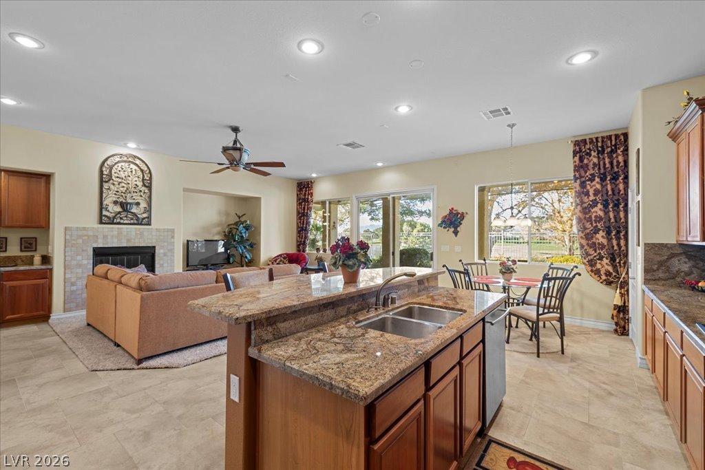 Image 4: An inviting open-concept layout connects the kitch