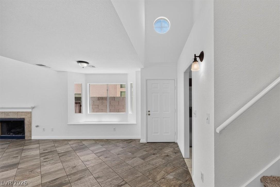 Image 2: A skylight illuminates the spacious entry with til