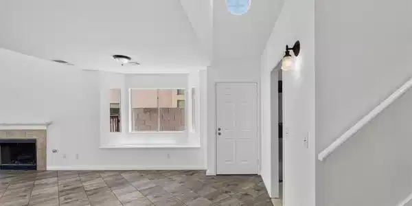 Image 2: A skylight illuminates the spacious entry with til