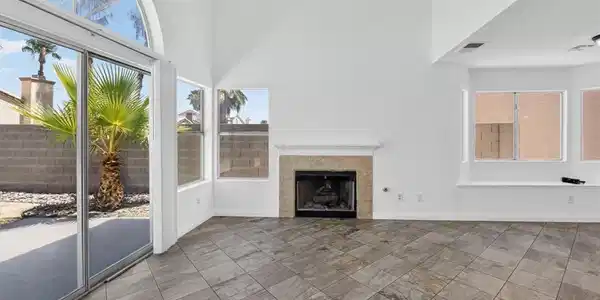 Image 4: Natural light floods this living area through gene