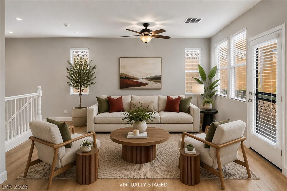Image 1: Naturally illuminated, this living space features