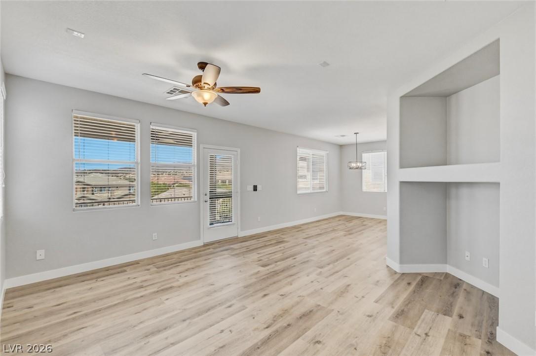Image 3: Natural light illuminates the spacious living area