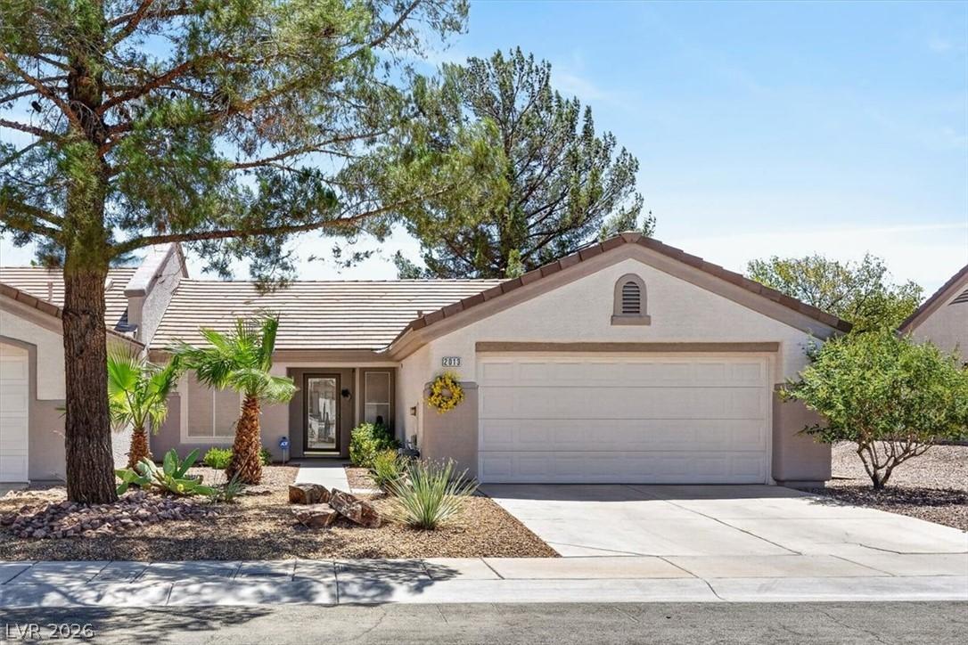 Image 2: A desert-friendly landscape greets the entryway of