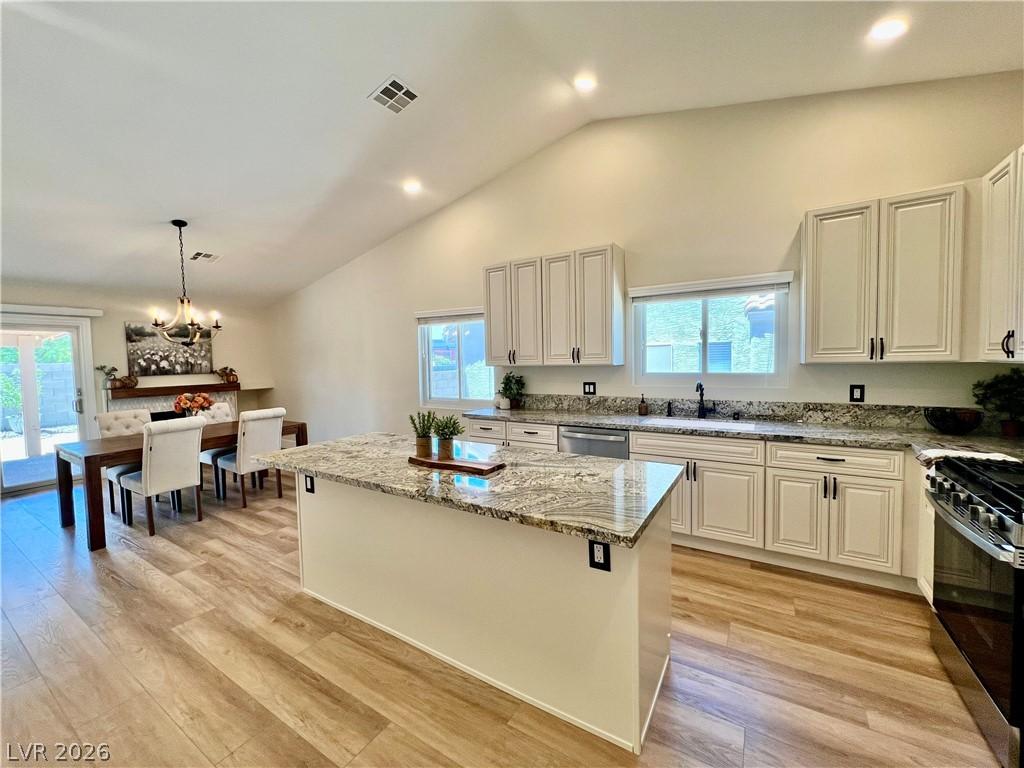 Image 3: Culinary delights await in this bright kitchen wit
