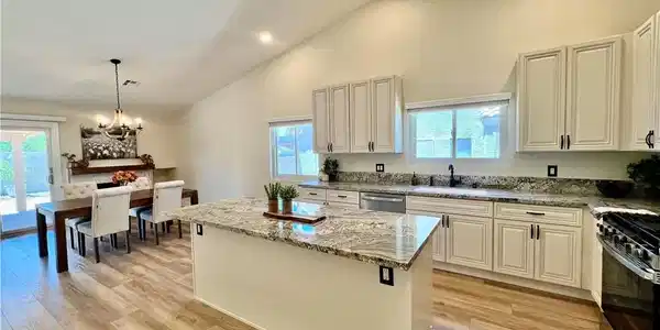 Image 3: Culinary delights await in this bright kitchen wit