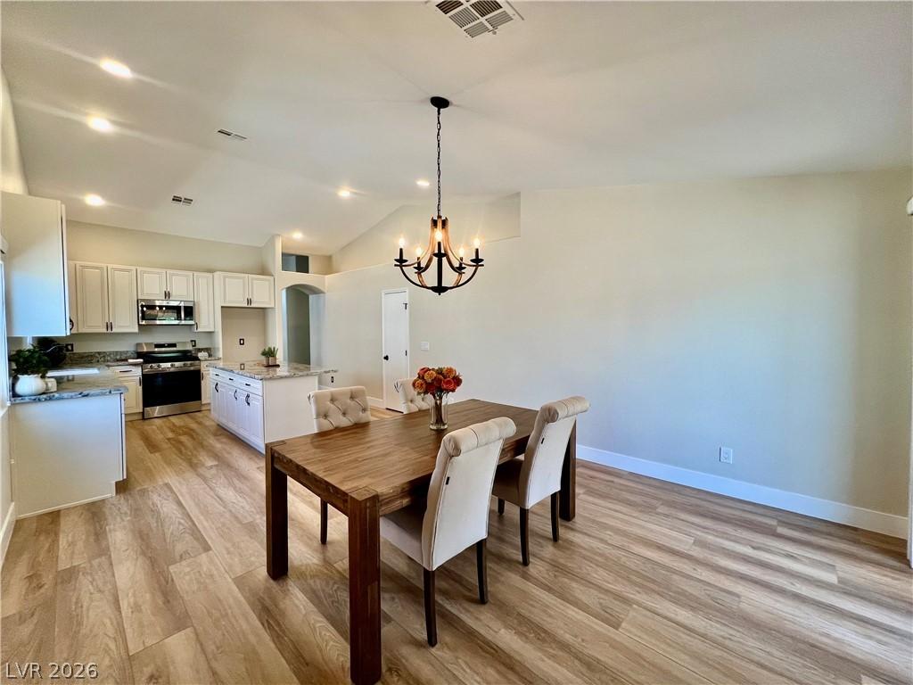 Image 4: An open concept design seamlessly blends the kitch