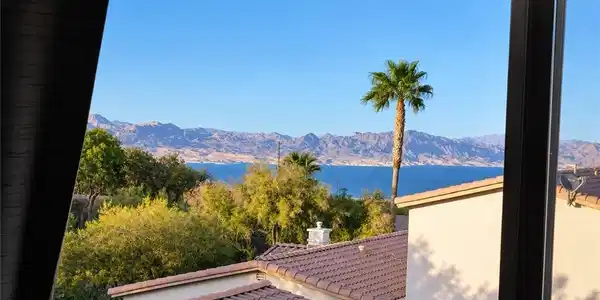 Image 4: Picturesque views of the lake and mountains are fr