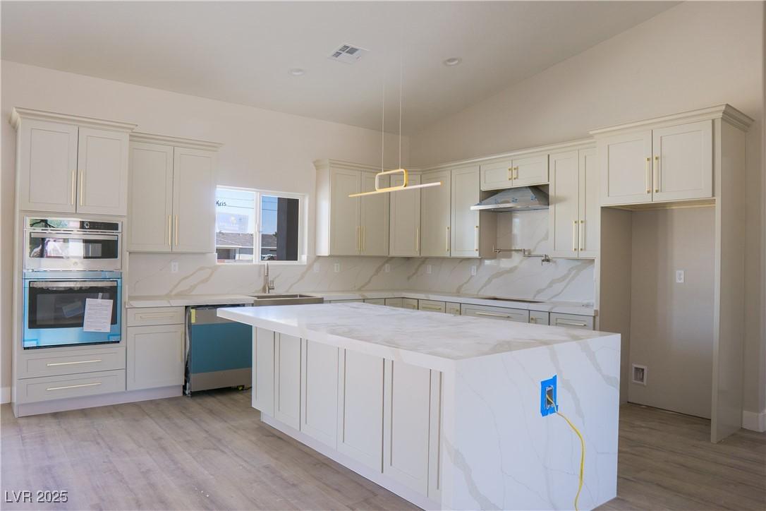 Image 3: Kitchen featuring dishwasher, under cabinet range