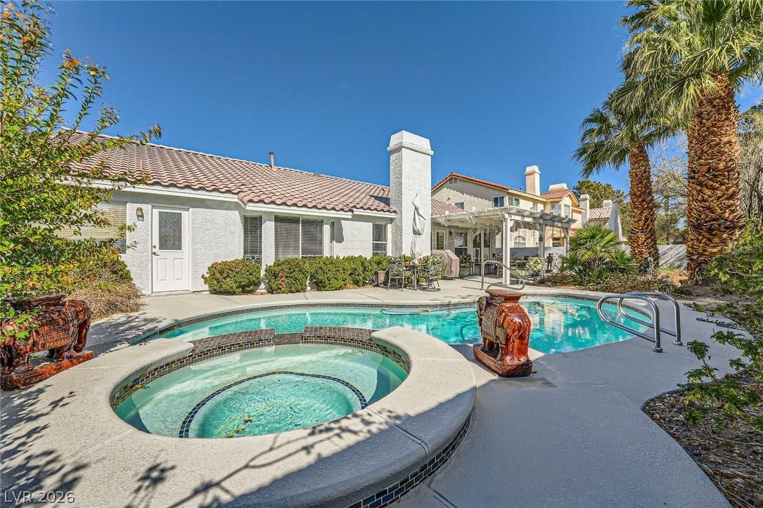 Image 2: Enjoy outdoor living with a sparkling pool and rel