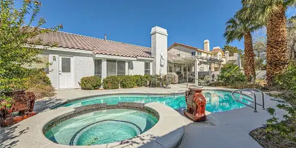 Image 2: Enjoy outdoor living with a sparkling pool and rel
