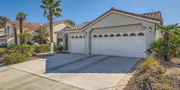 Image 4: This home features a well-maintained exterior and