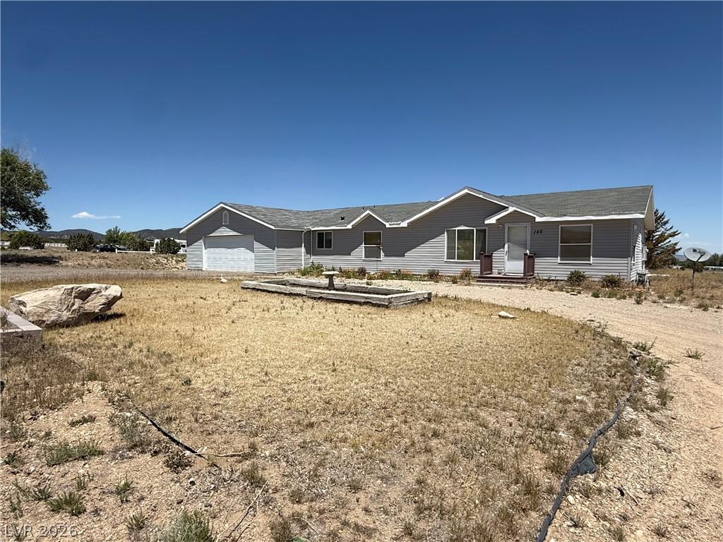 Image 2: A classic ranch home nestled amidst a spacious lot