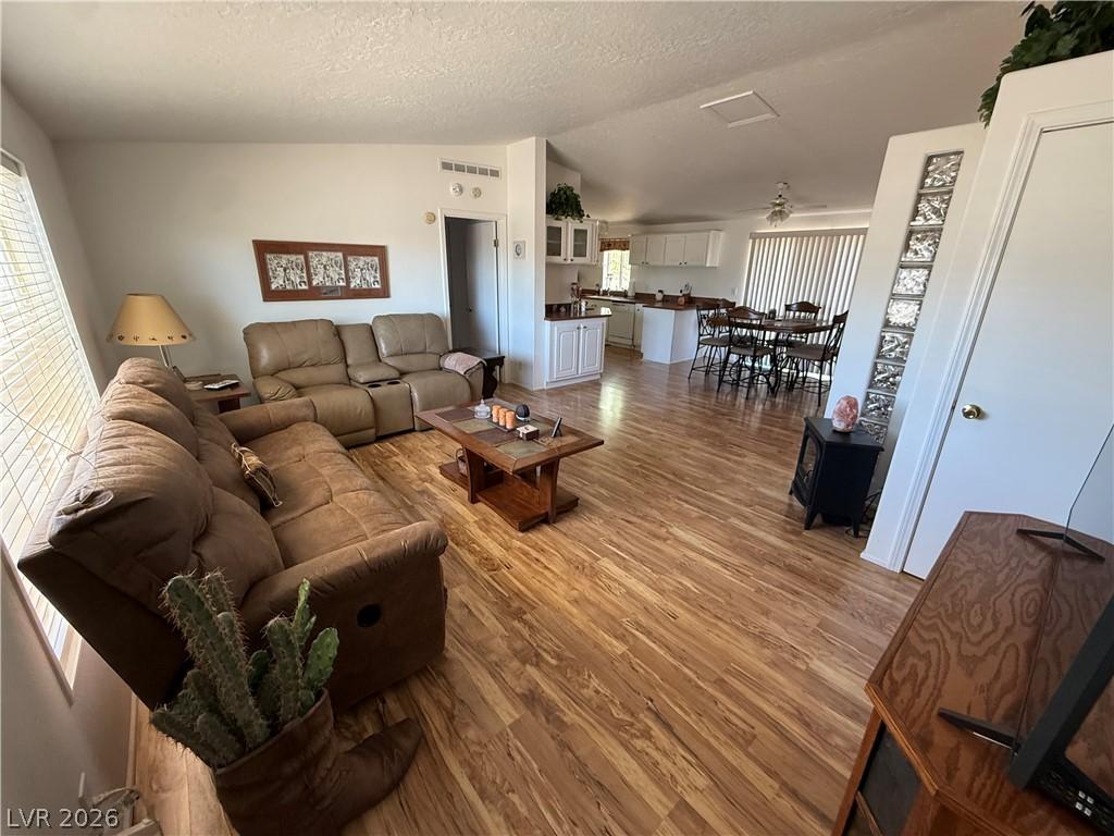 Image 3: An inviting open floorplan seamlessly connects the