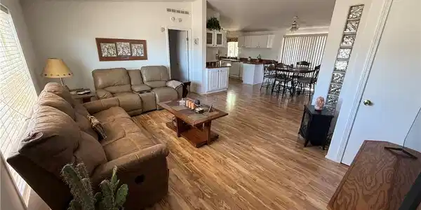 Image 3: An inviting open floorplan seamlessly connects the