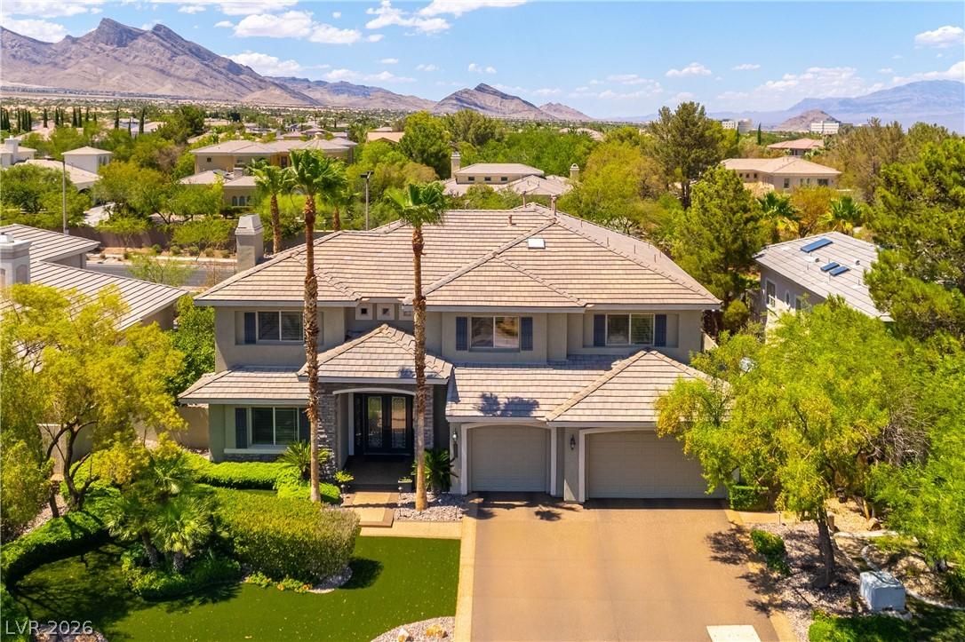 Image 1: Grand estate with a multi-car garage and manicured