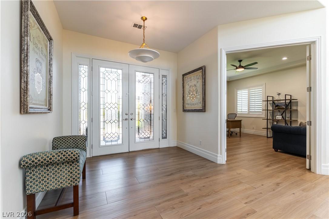 Image 4: Enter into a bright foyer, where elegant leaded gl
