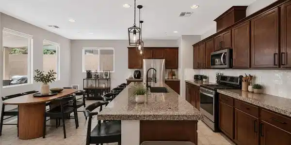 Image 2: A well-appointed kitchen features a large island a