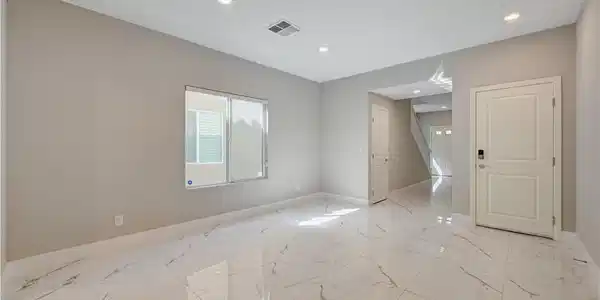 Image 3: Polished tile flooring and recessed lighting defin