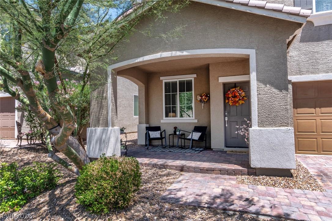 Image 3: A welcoming covered porch with ample seating await