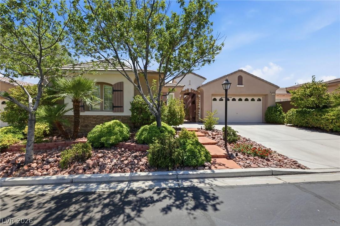 Image 2: A welcoming front exterior features a paved drivew