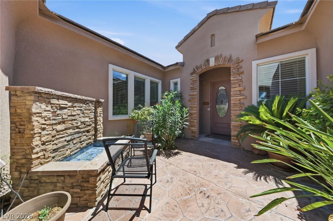 Image 4: An inviting front entry welcomes with a decorative