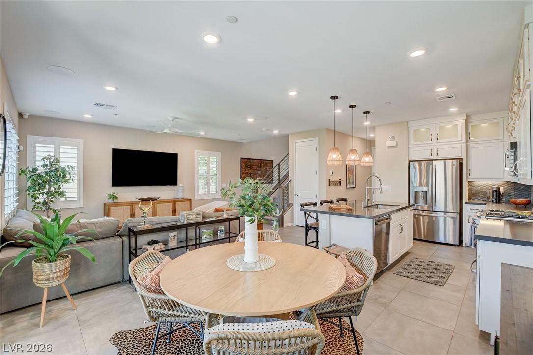 Image 2: An open concept living area seamlessly blends a we