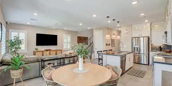 Image 2: An open concept living area seamlessly blends a we