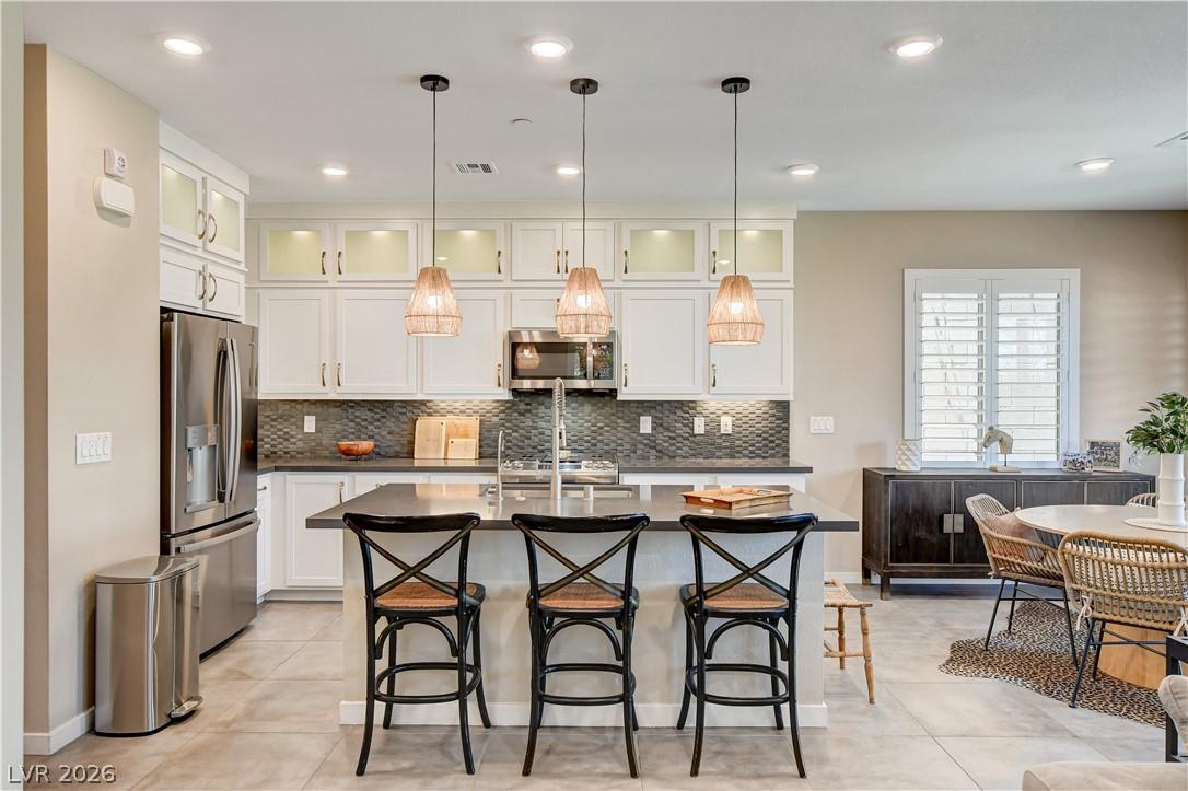 Image 3: An inviting kitchen with a central island and cont