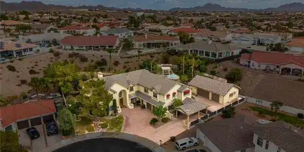 Image 2: An aerial perspective reveals a grand estate nestl
