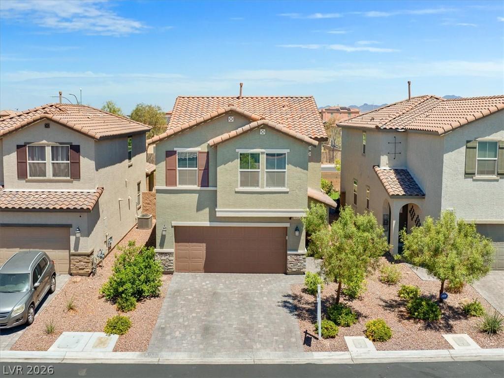 Image 3: A traditional tile roof crowns this charming home
